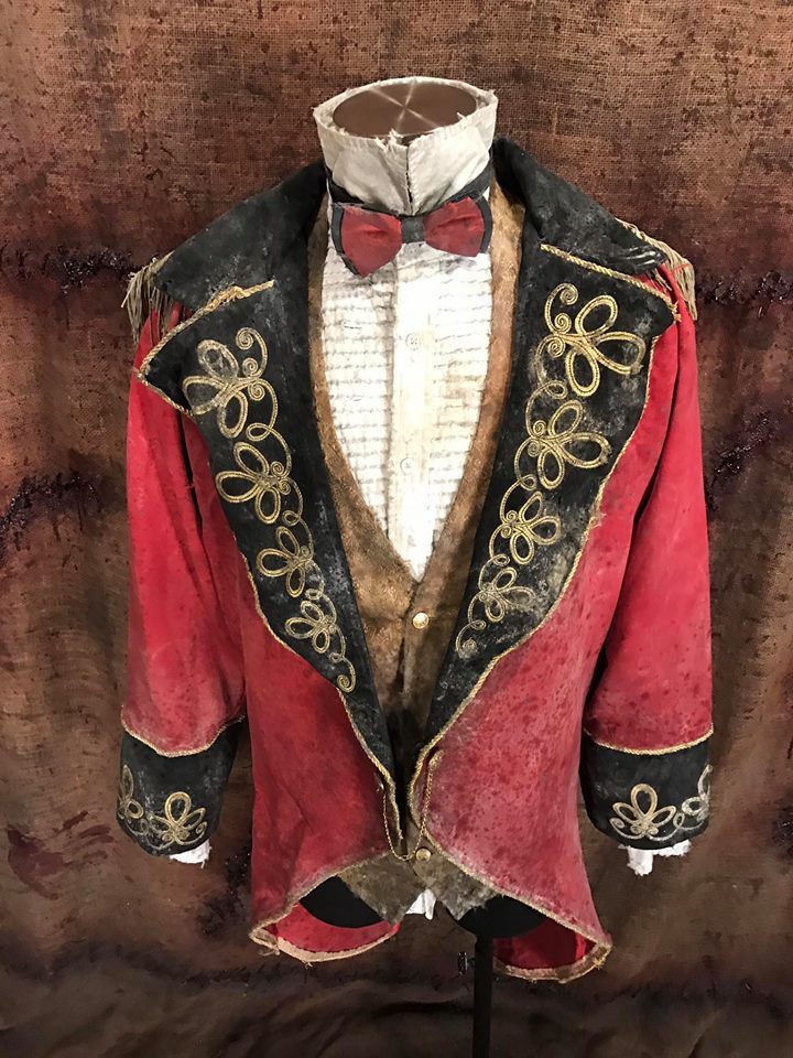 a red and black jacket with a bow tie