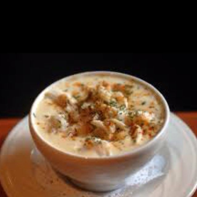 a white bowl filled with soup on top of a table