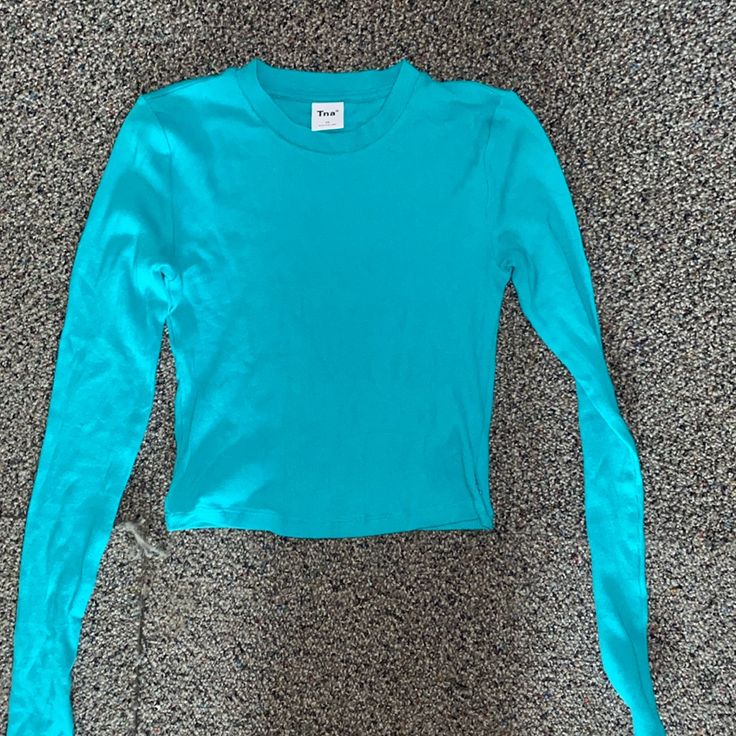 Perfect Condition Nwot Tna Baby Tee. Worn Only Once Blue Stretch Crew Neck Top, Basic Blue Tops For Fall, Blue Long Sleeve Basic T-shirt, Basic Blue Long Sleeve T-shirt, Fitted Long Sleeve Blue T-shirt, Light Blue Stretch Crew Neck Top, Blue Crew Neck Top For Fall, Fitted Blue Cotton Top, Trendy Blue Long Sleeve Tops