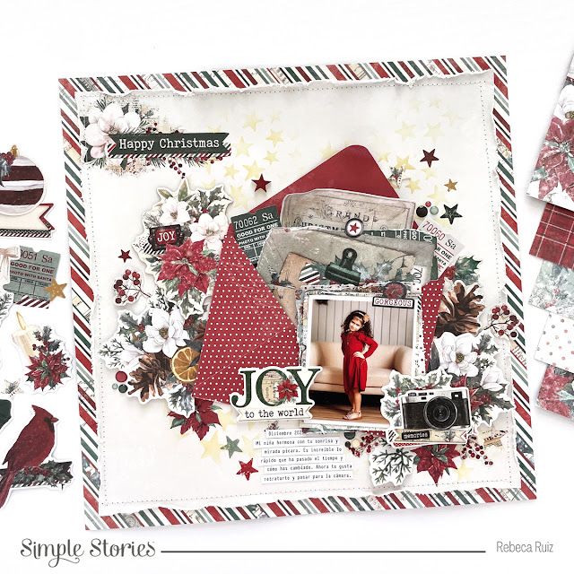 a scrapbook page with paper and christmas decorations