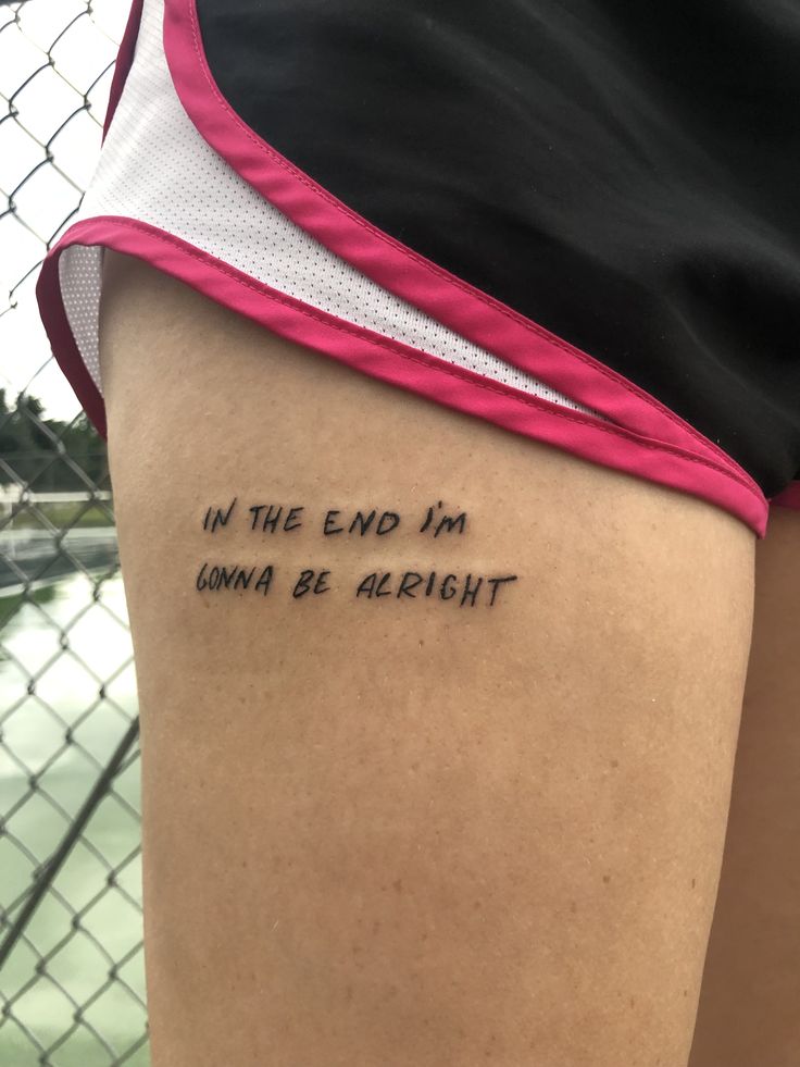 the back of a woman's leg with writing on it that says in the end i'm going to be alright