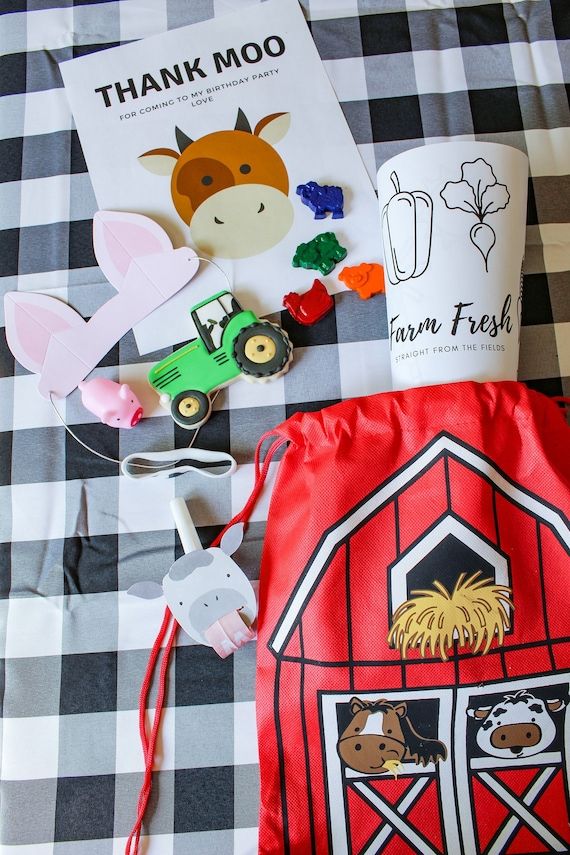 the farm themed bag is filled with farm animals and other things to make it look like they're going on a farm