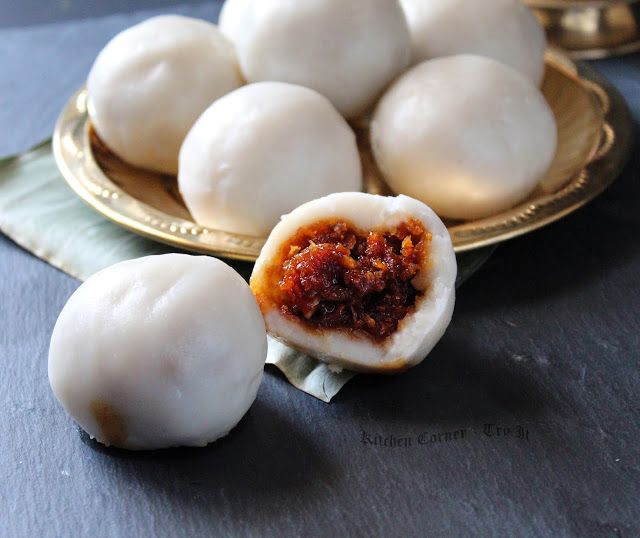 some dumplings are sitting on a gold plate