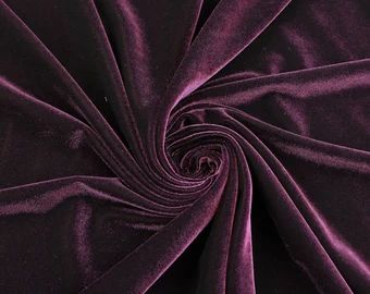 a close up shot of a purple velvet fabric with very thin lines on the edges