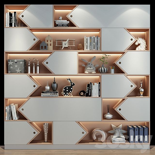 a book shelf with many books on top of it in front of a white wall