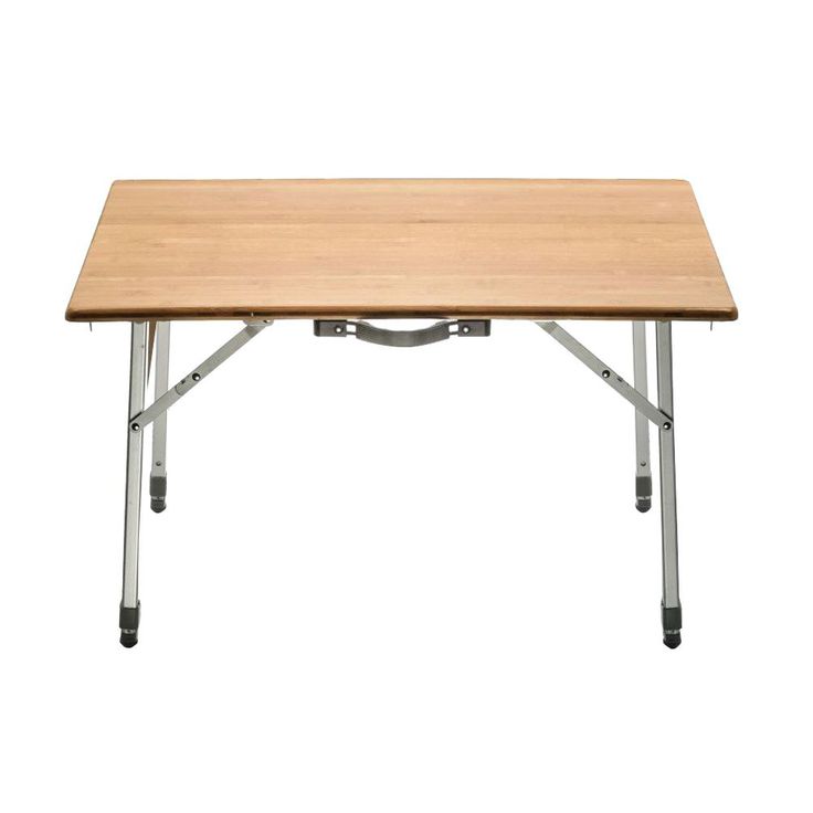 a wooden table sitting on top of a white floor