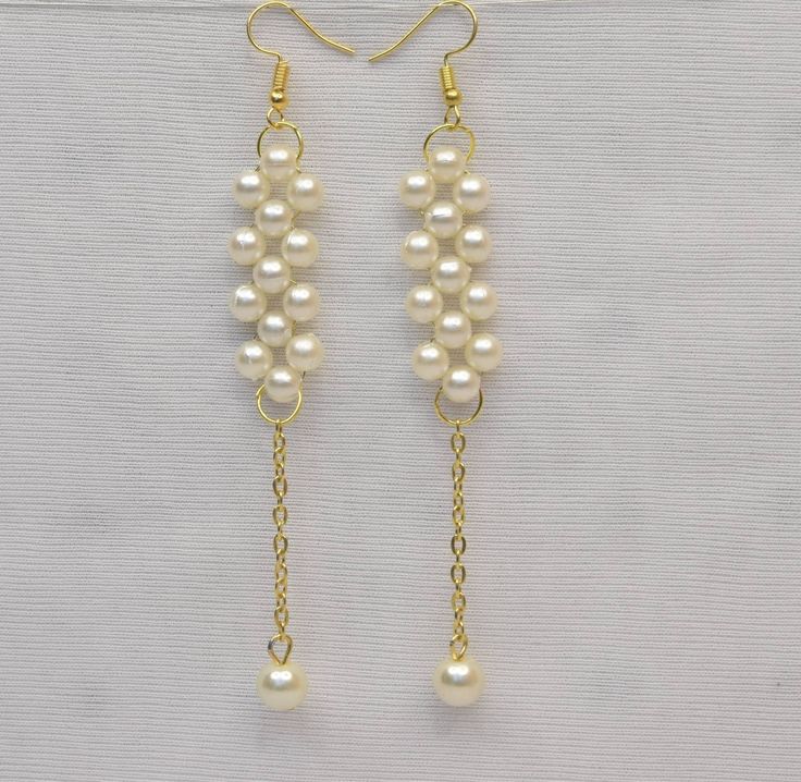 This is Indian test of earrings perfect for wedding and party. White Pearl Linear Earrings For Formal Occasions, White Pearl Chain Linear Earrings For Party, Formal White Pearl Chain Chandelier Earrings, Elegant Handmade Linear Earrings For Parties, Elegant Handmade White Linear Earrings, Elegant White Handmade Linear Earrings, Party Long Drop Pearl Bridal Earrings, Pearl Long Drop Earrings For Party, Long Drop Pearl Earrings For Party