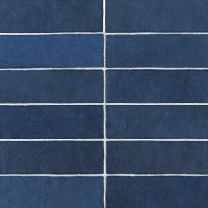 a blue tiled wall with white lines painted on the tiles in different colors and sizes