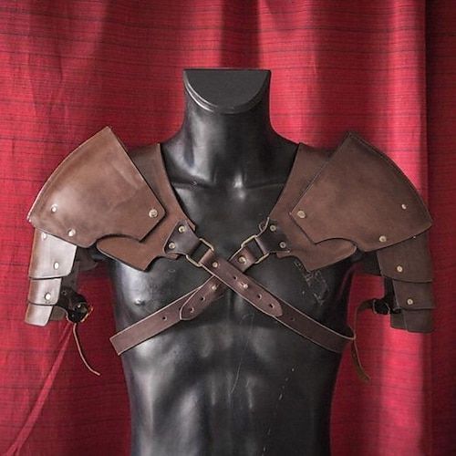 a male mannequin with leather armor on it's chest and shoulder straps