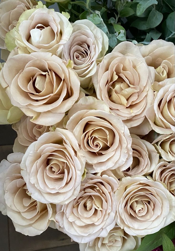 a bunch of flowers that are sitting on a table