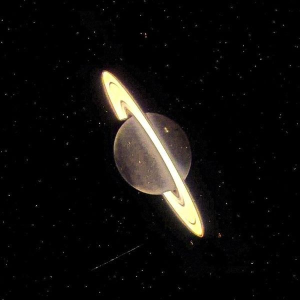 an artist's rendering of saturn and its rings in the night sky with stars