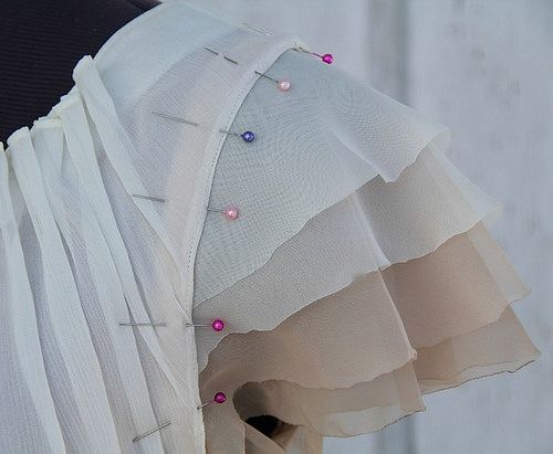 the back of a woman's dress with buttons on it