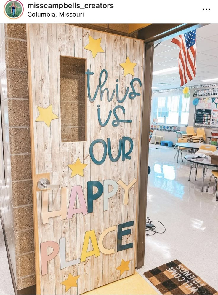 this is our happy place sign in the middle of an empty classroom with chairs and desks