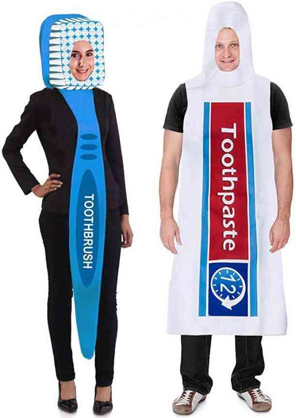 two people in costumes standing next to each other with toothbrushes on their heads