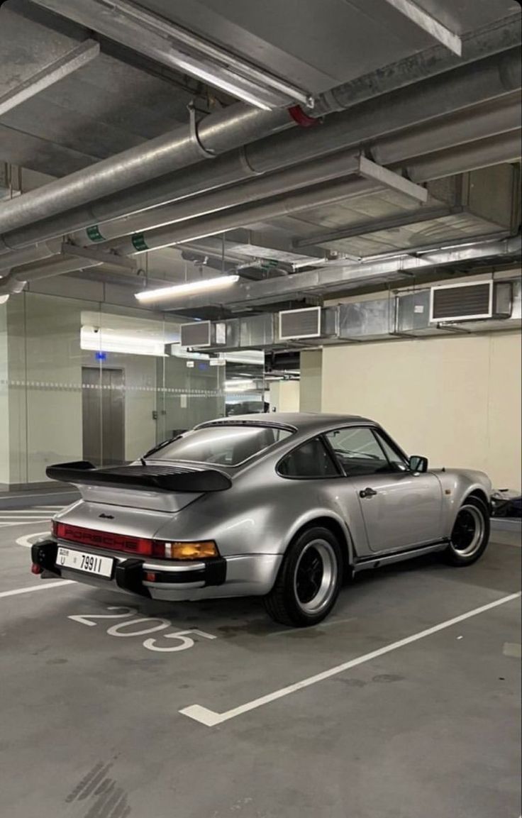 a car is parked in an empty parking garage