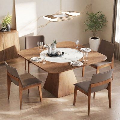 a dining room table with chairs around it