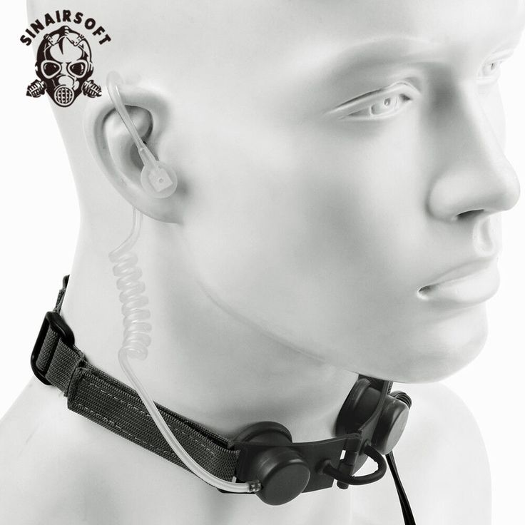 an image of a man with ear buds on his ears and headphones attached to his neck