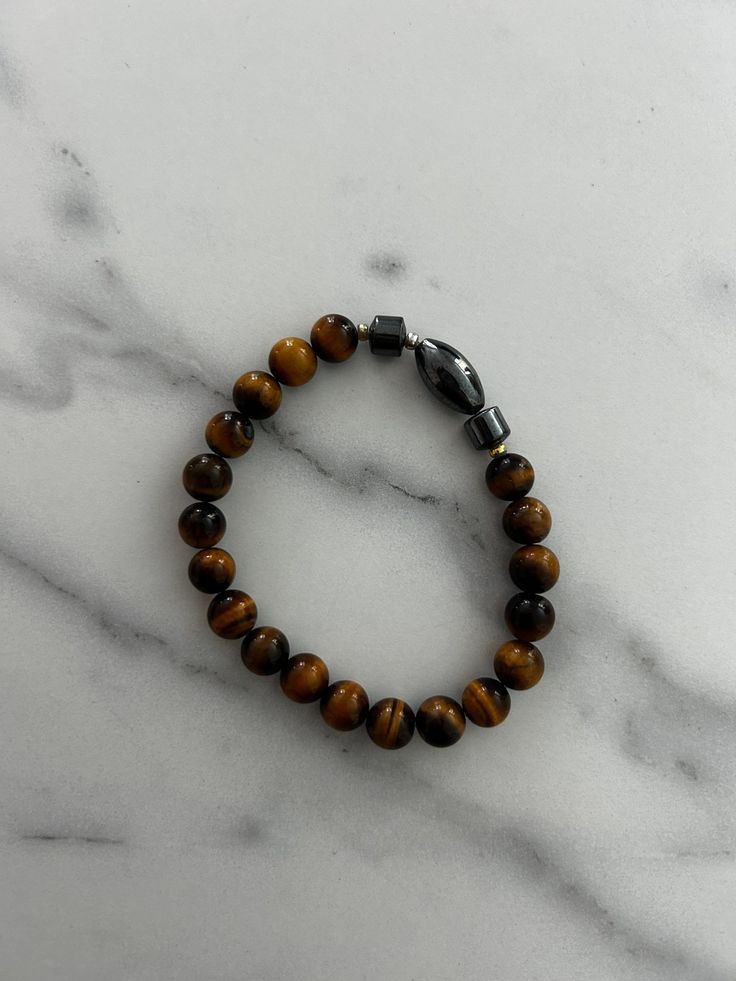 Tigers eye gemstone bracelet Modern Bracelets With Natural Stones, Modern Magnetic Jewelry For Gifts, Modern Natural Stone Round Bracelets, Magnetic Hematite Bracelet, Modern Magnetic Bracelet Jewelry, Brown Hematite Jewelry Gift, Elegant Hematite Bracelets With Gemstone Beads, Elegant Hematite Bracelet With Gemstone Beads, Brown Gemstone Round Bracelets