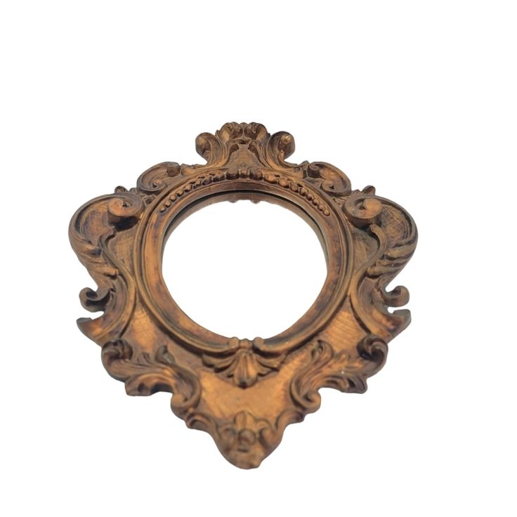 an ornate gold frame on a white background