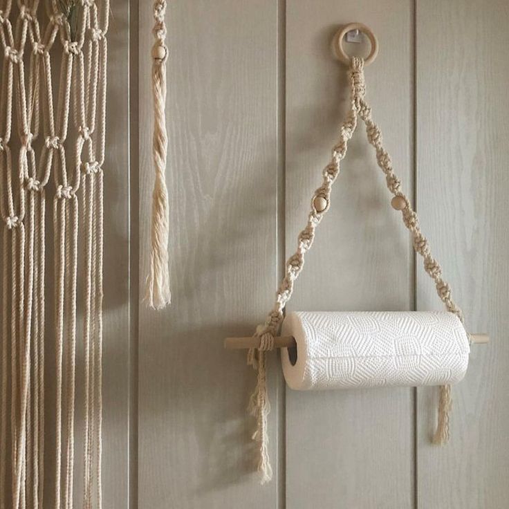 a roll of toilet paper hanging from a rope