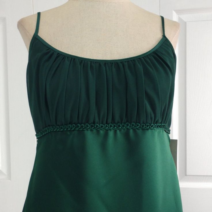 a woman's green dress on a mannequin