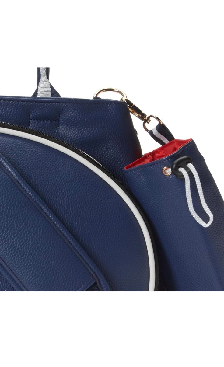 a blue handbag with a red and white stripe