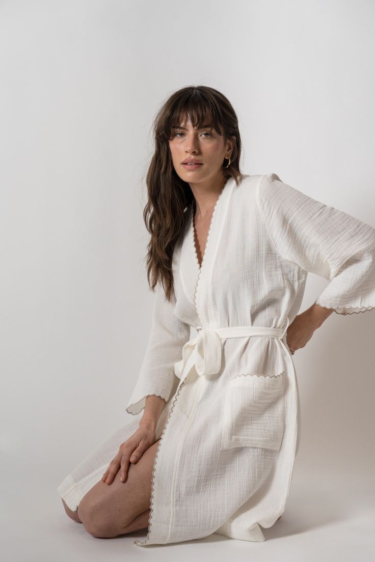 Alaia Kimono Chic White Loungewear Cover-up, Spring Cream Robe For Loungewear, Chic White Lounging Sleepwear, Chic White Sleepwear For Lounging, White Spring Kimono For Relaxation, Cream Kimono For Spring Loungewear, Spring Cream Kimono For Loungewear, Chic Summer Loungewear Robe, Chic Summer Sleep Robe