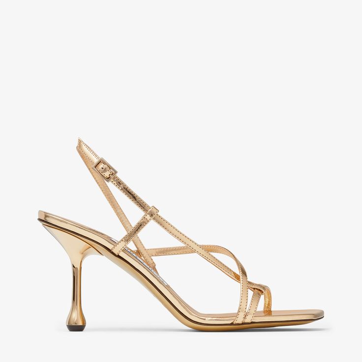 A sculptural design with a graphic drop heel, the Etana sandal is modern update to a wardrobe classic. Crafted from leather with a metallic finish, this statement design features crossover straps and an adjustable fastening. Jimmy Choo Gold, Monk Strap Shoes, Wardrobe Classic, Leather Lingerie, Ballet Pumps, Boot Pumps, Jimmy Choo Shoes, Footwear Design Women, Fine Jewelry Designers