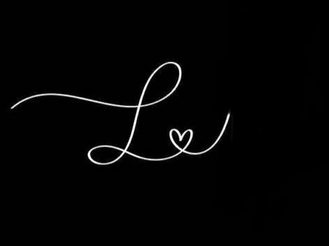 the word love written in white ink on a black background