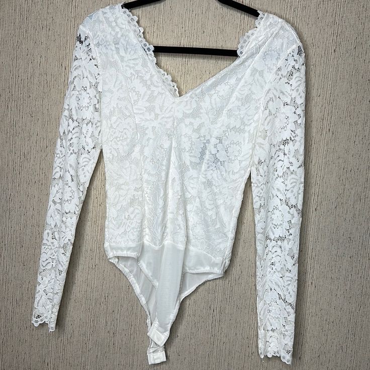 Brand New Women’s White Lace Body Suit Has Lining From The Shoulders Down, Arms Are An Open Lace Two Snaps At The Bottom V Neck On The Front And Back Summer V-neck Lace Bodysuit, Spring White Lace Bodysuit, Lace Body Suit, Yellow Bodysuit, Square Neck Bodysuit, Velvet Bodysuit, Lace Body, Ribbed Bodysuit, Lace Bodysuit