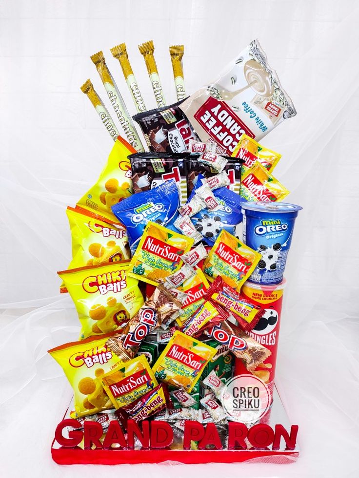 a pile of snacks sitting on top of a red sign