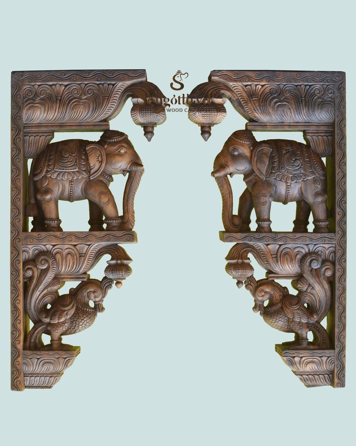 two wooden carvings depicting elephants and an elephant with its trunk in the air, on a light blue background