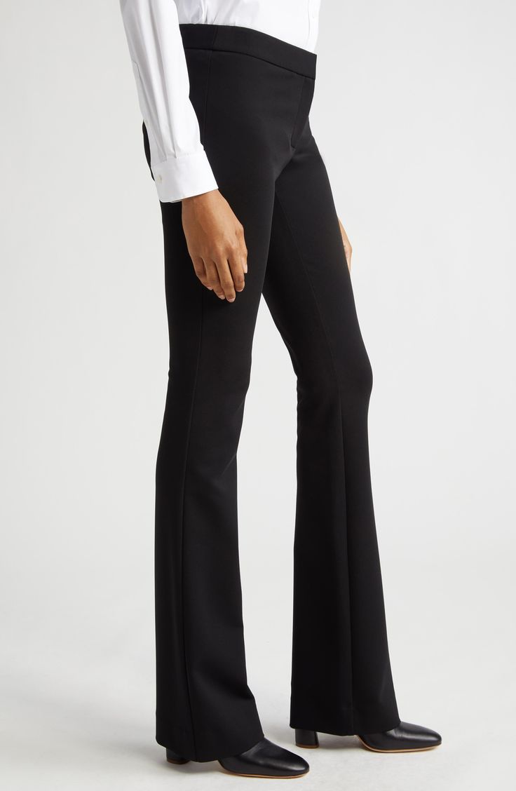 Staple black trousers fit slim through the leg before kicking out into a fun flare at the hem. 33 1/2" inseam; 22" leg opening; 10" front rise; 16" back rise (size 16) Zip fly with hook-and-bar closure Back welt pockets Lined 68% viscose, 28% polyamide, 4% elastane Dry clean Imported Designer Clothing Classic Mid-rise Fitted Flares, Elegant Black Flares For Night Out, Classic Fitted Mid-rise Flares, Classic Fitted Bottoms With Flared Hem, Black Flare Wide Leg Pants For Office, Chic Flared Hem Bottoms For Evening, Fitted Mid-rise Formal Pants, Formal Fitted Mid-rise Pants, Stretch Elastane Pants With Standard Cut Leg