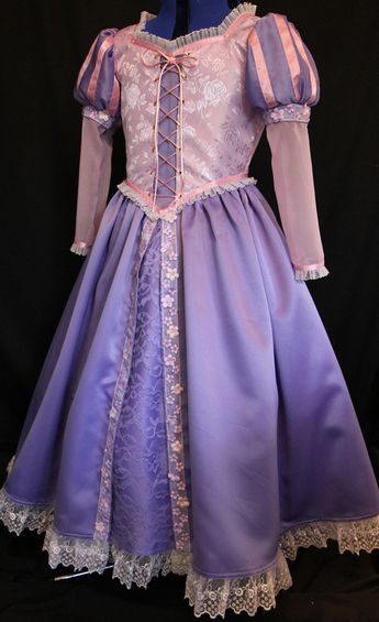 a purple dress with white lace on it