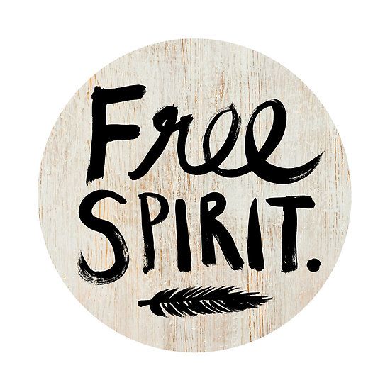 a wooden sign that says free spirit with an arrow in the middle and black ink on it