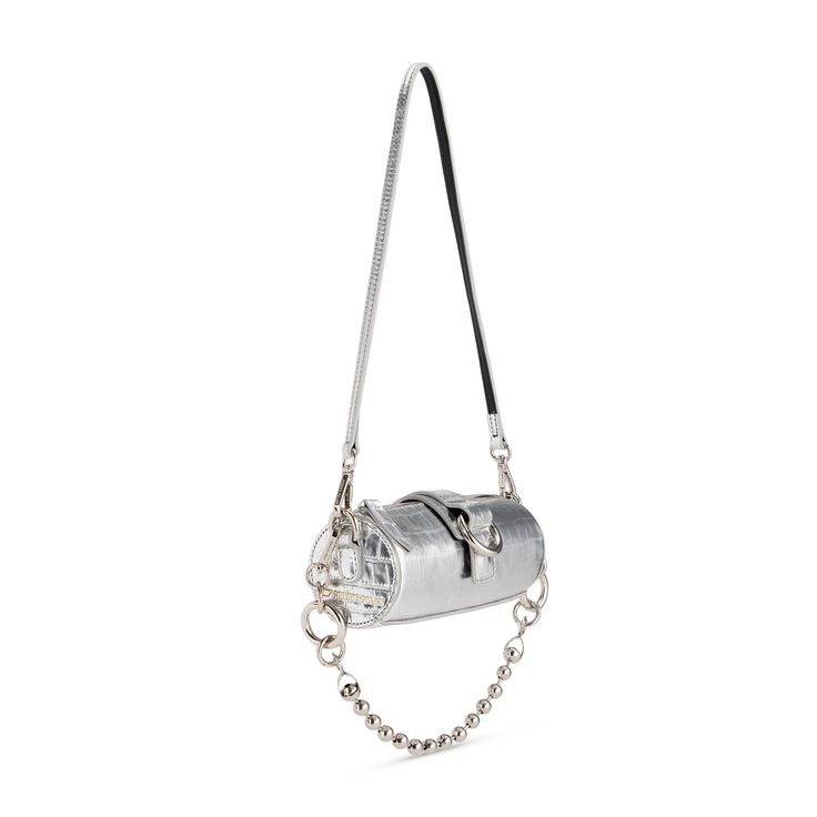 As the IT bag, PRIVATE POLICY Mini Barrel Bag is the trend and unique accessory for uplifting any outfit. The iconic silver color metal ring and strap set this cool leather bag to be anything but ordinary. - Silver metallic color - Embossed leather mini barrel bag - Light gold logo at the side - Metal ball chain and leather strap options - Signature center open ring detail - Cow Leather Dimension: Length 6.5inch x Height 2.5 inch x Width 2.5inch Show off your style with this Mini Barrel Bag with Designer Silver Bag With Metal Logo, Luxury Silver Shoulder Bag With Metal Logo, Silver Bag With Metal Logo For Everyday Use, Luxury Silver Shoulder Bag With Chain Strap, Silver Evening Bag With Metal Logo, Luxury Silver Metal Bag, Luxury Silver Bag With Chain Strap, Luxury Silver Bags With Chain Strap, Luxury Metal Bags With Chain Strap