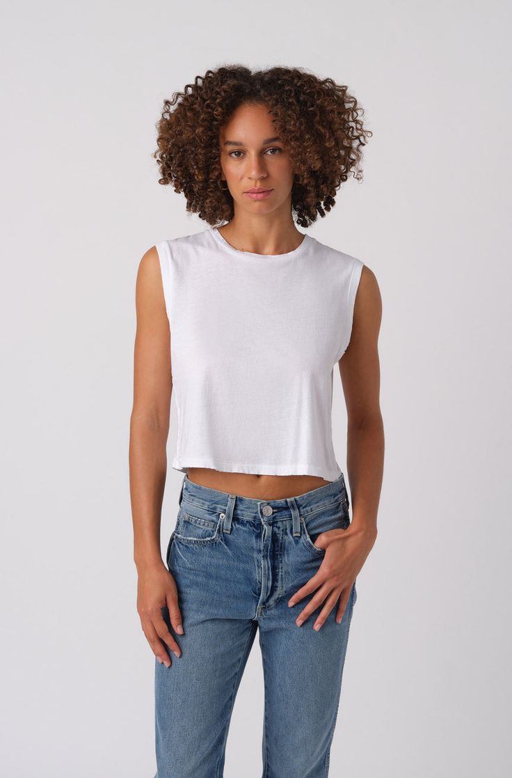 AMO Sleeveless Babe Tee in White Cotton Cropped Hem T-shirt For Summer, Relaxed Fit Cropped T-shirt For Summer, Casual Cropped Tank Top For Everyday, Casual Stretch Cutoff Tops, Basic Spring Crop Top, Trendy Fitted Cutoff Tops, Stretch Cotton Cutoff Tops, Basic Boxy Cropped T-shirt For Summer, Casual Slightly Cropped Tank Top For Spring