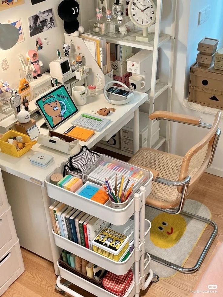 a white desk topped with lots of books