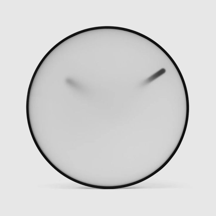 a black and white clock face on a gray background