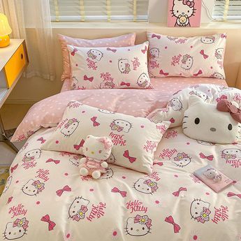 hello kitty bedding set with pink polka dots and bows on the comforter, pillowcases and duvet covers