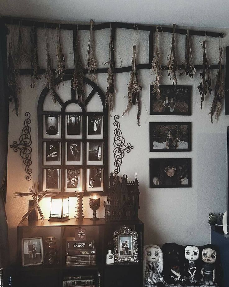 a living room filled with furniture and pictures on the wall