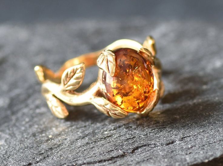 Gold Amber Ring set with a Natural Amber in the highest quality & brownish-yellow translucent resin, at 10x8mm, 3 Carats, sourced from Russia. Gold Leaf Ring made of Gold Vermeil ☞ thickest 18k Gold Plating on top of Solid 925 Sterling Silver ☞ made to last. Matching Earrings & Matching Pendant - please ask me ☞ Choose your size ☞ I resize (before shipping) for FREE to Any size* ⌛Last Ring left ⌛ ❀ Each Natural Gem is unique & will have Slight variations from the product pictures "no two Natural Unique Yellow Gold Crystal Ring, Luxury Nature-inspired Recycled Gold Rings, Earthy Rings By Angeline, Luxury Nature-inspired Rings In Recycled Gold, Amber Engagement Ring, Proposal Ring Gold, Imperial Topaz Ring, Gold Leaf Ring, Honey Jewelry