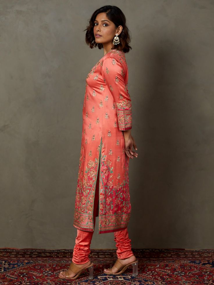 Editor's Note Elevate your ethnic elegance with our coral/pink ari-hand embroidered arin kurta set, including bottoms and a matching dupatta. This ensemble features intricate hand embroidery, making it the perfect choice for special occasions and festive celebrations, exuding timeless charm and style. Color: Pink Fabric: Silk satin Components: Kurta, pants and dupatta Occasion: Festive Note: Product colour may slightly vary due to photographic lighting sources Care: Dry clean only About the Desi Pink Kurta With Embroidered Border For Diwali, Pink Embroidered Kurta For Diwali, Pink Straight Kurta Anarkali Set With Embroidered Border, Navratri Pink Palazzo Set With Embroidered Border, Navratri Pink Embroidered Palazzo Set, Pink Embroidered Border Palazzo Set For Navratri, Pink Wedding Kurta With Embroidered Border, Pink Palazzo Set With Embroidered Border And Straight Kurta, Pink Kurta With Embroidered Border And Traditional Drape