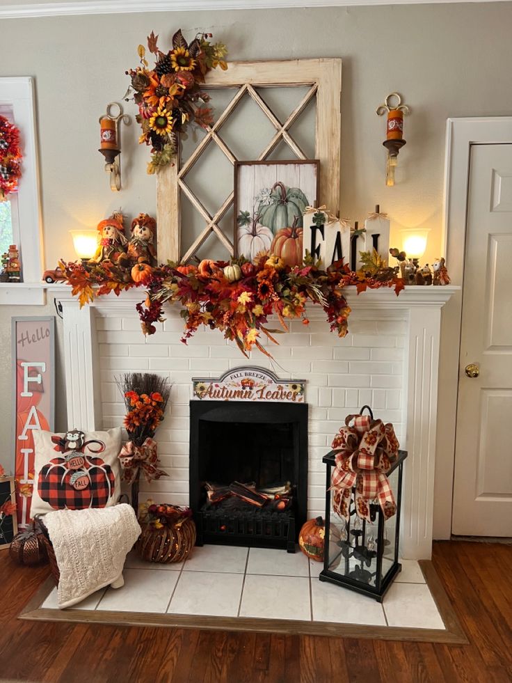 a fireplace decorated with fall decorations and pumpkins