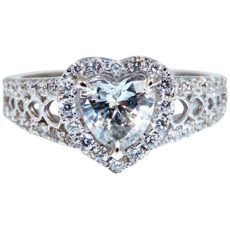 GIA Certified Diamond Heart Cut Halo cluster ring. 1.27ct. Natural Heart Shape diamond G color I-1 clarity Please see report copy attached: #6217187770 Natural Side diamonds: Rounds, .60ct G-color, Vs-2 Clarity. 14kt. white gold. Ring size: 9 We may resize. Deck of ring: 11 X 11mm Depth of ring: 5mm 4.8 Grams. $16000 Appraisal certificate will accompany. Gia Certified Heart Cut Diamond Ring, Heart Shaped Moissanite Diamond Ring With Brilliant Cut, Gia Certified Heart Cut Diamond Anniversary Ring, Gia Certified Heart Diamond Rings, Gia Certified Heart Shaped Anniversary Ring, Gia Certified Heart-shaped Ring For Anniversary, Heart-shaped Gia Certified Ring For Anniversary, Cubic Zirconia Diamond Ring With Brilliant Heart Cut, Heart Cut Moissanite Diamond Ring With Center Stone