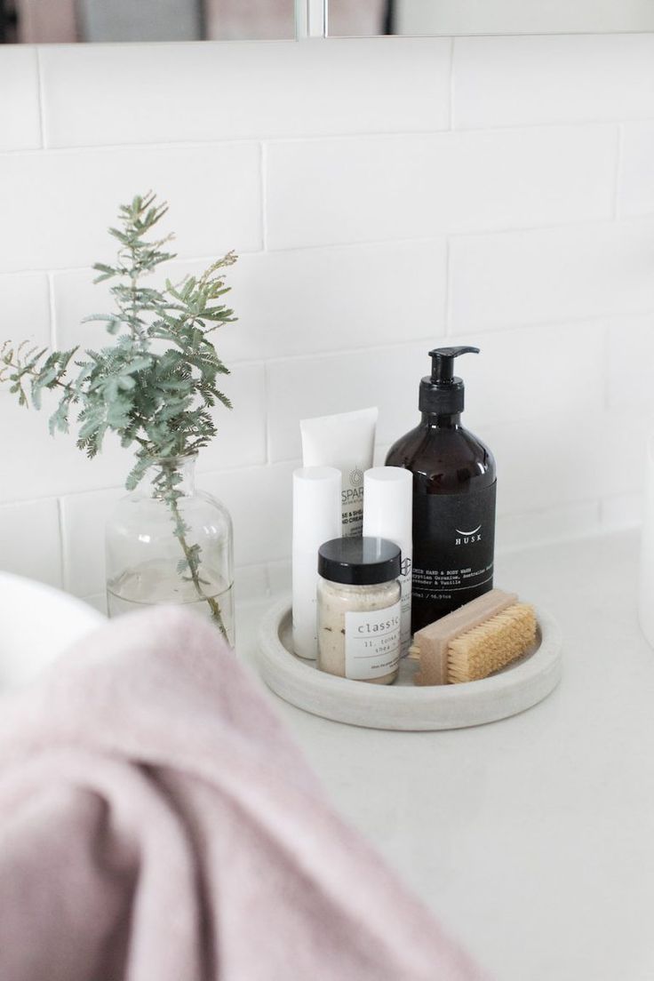 the bathroom counter is clean and ready to be used as a holder for personal care items