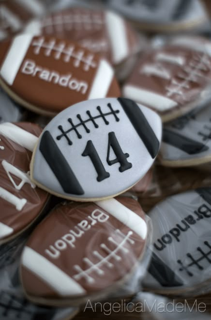 cookies decorated with footballs and numbers are on display