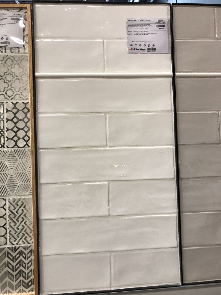 some white and black tiles are on display