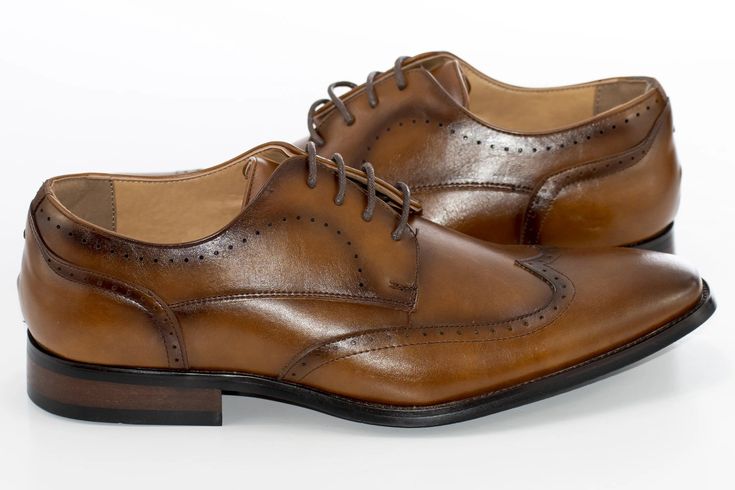 Cognac brown exterior and sweeping wingtip oxford-style lace give these shoes a rich, vintage look which is always appropriate for business or pleasure. Great for a classy, reserved look in the office or at prom. Oxford Style, Wingtip Oxford, Derby Shoes, Vintage Look, Vintage Looks, Cognac, Derby, Dress Shoes Men, Oxford Shoes