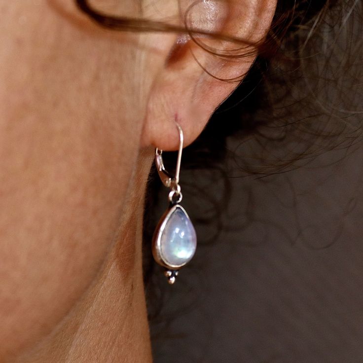 "Sterling silver Moonstone dangle earrings, Teardrop Moonstone earrings, Simple everyday earrings, Birthstone earring. Also available with- Garnet, Blue Opal, White Opal, Labradorite, and in Gold plating. ♥ ♥ ♥ Moonstone- Encourages hope, enhances feminine energies, sensitivity, intuition, and psychic abilities. Known to bring strong energies of abundance to one's life. 🌸 Product details: Handmade necklace 🌸 Measurements: weight-4.1gr. Drop size- 0.78\"X0.39\" (20X10mm) Stone Diameter - 0.39\" Earrings Long Silver, Silver Wire Earrings, Long Silver Earrings, Moonstone Earrings, Sterling Silver Dangle Earrings, Birthstone Earring, Earrings Long, Opal Earrings, Everyday Earrings